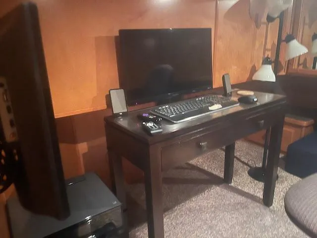 Slide: The Image of Home office setup on 2009 Horizon 18 x 85 Houseboat with desk, monitor, and keyboard. - 22