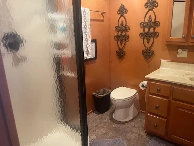 Slide: The Image of Bathroom interior of 2009 Horizon 18 x 85 Houseboat with shower and wooden cabinets. - 26