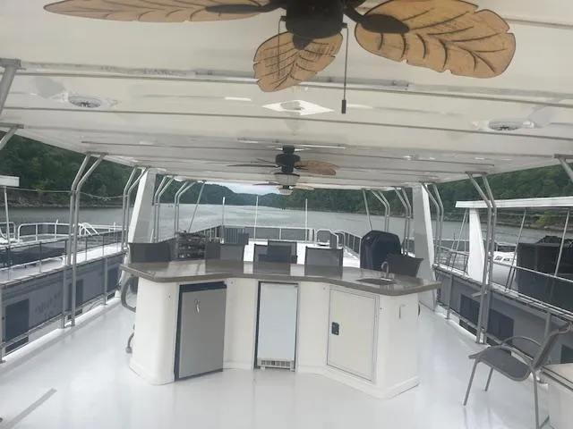 Slide: The Image of Spacious 2009 Horizon 18 x 85 houseboat interior with modern kitchen and scenic lake view. - 41