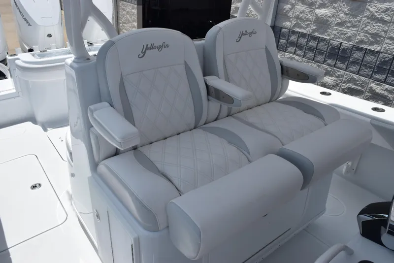 Slide: The Image of 2024 Yellowfin 36 Offshore boat with luxurious white seating and armrests. - 12