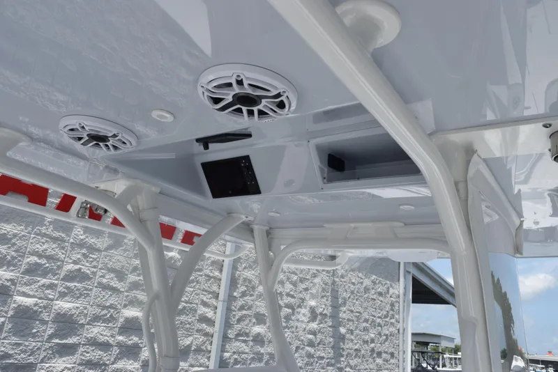 Slide: The Image of 2024 Yellowfin 36 Offshore boat interior with speakers and storage compartments. - 13