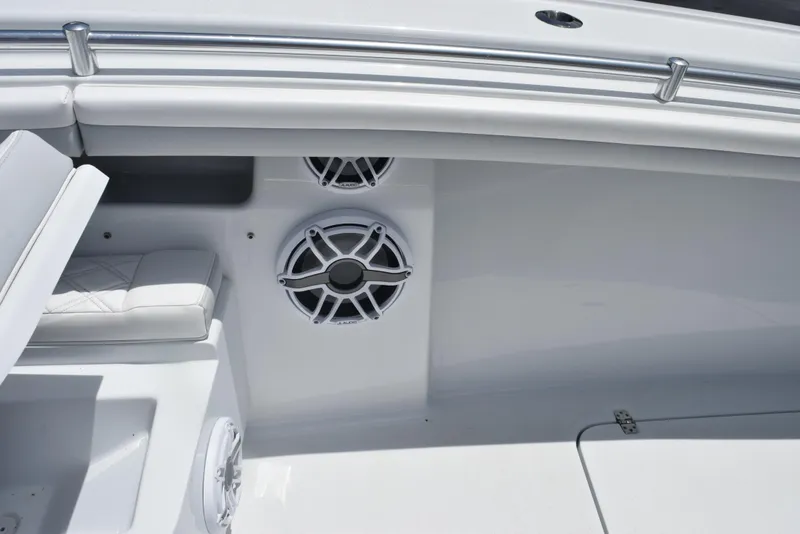 Slide: The Image of 2024 Yellowfin 36 Offshore boat interior with speakers and seating. - 17