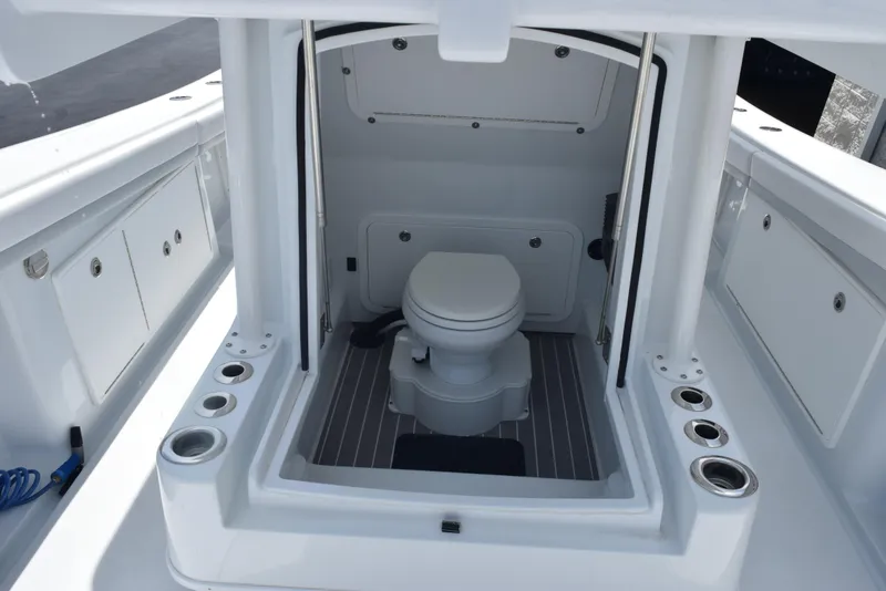 Slide: The Image of 2024 Yellowfin 36 Offshore boat interior with toilet, showcasing modern marine amenities. - 22