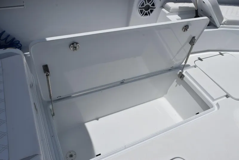 Slide: The Image of 2024 Yellowfin 36 Offshore boat storage compartment open, showcasing spacious interior. - 27