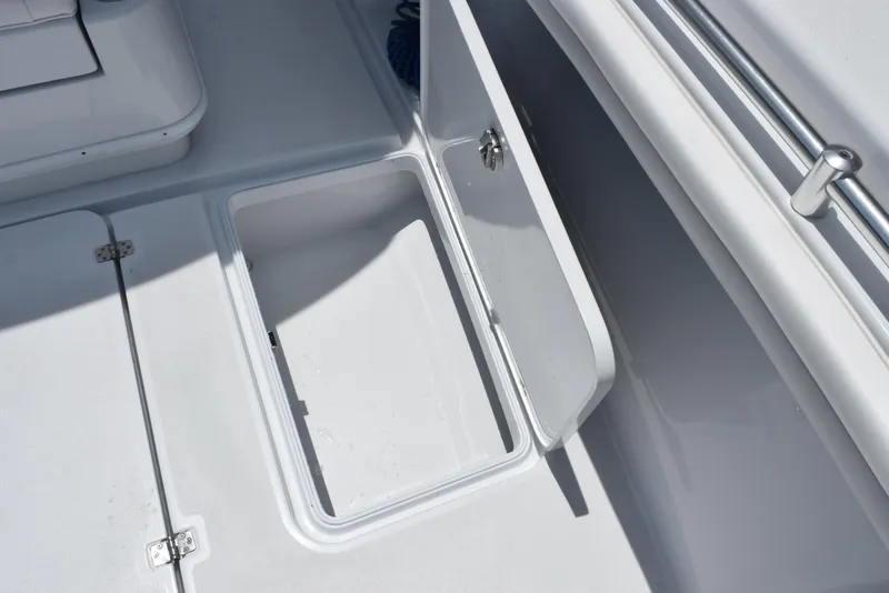Slide: The Image of 2024 Yellowfin 36 Offshore boat storage compartment with open hatch. - 28