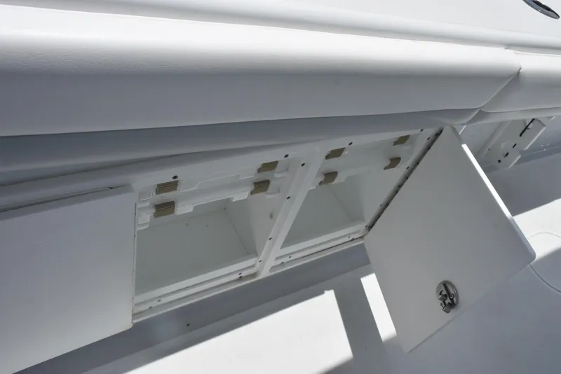 Slide: The Image of 2024 Yellowfin 36 Offshore boat storage compartments with open doors. - 31