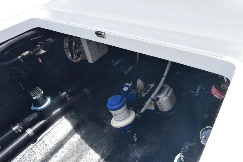 Slide: The Image of 2024 Yellowfin 36 Offshore boat engine compartment with visible components and wiring. - 36