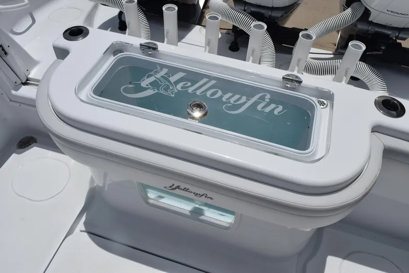 Slide: The Image of 2024 Yellowfin 36 Offshore boat livewell with logo and rod holders. - 37