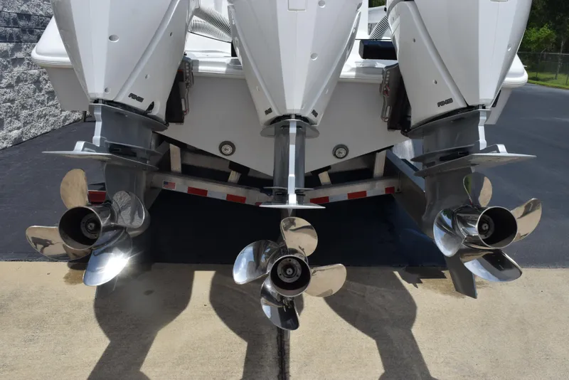 Slide: The Image of 2024 Yellowfin 36 Offshore boat with powerful dual outboard engines and stainless steel propellers. - 5