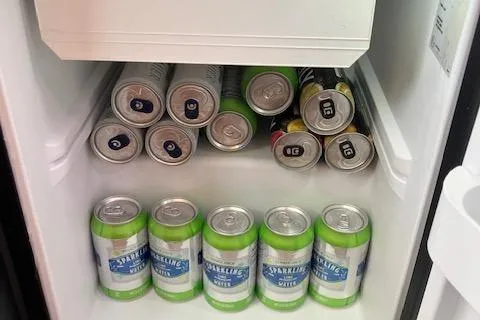 Slide: The Image of Cans of sparkling water and soda in a refrigerator on a 2005 Back Cove Downeast Hardtop. - 14