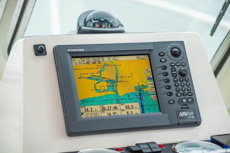 Slide: The Image of Navigation system on 2005 Back Cove Downeast Hardtop boat dashboard. - 22