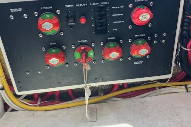 Slide: The Image of Control panel of a 2005 Back Cove Downeast Hardtop boat with labeled switches and wiring. - 43
