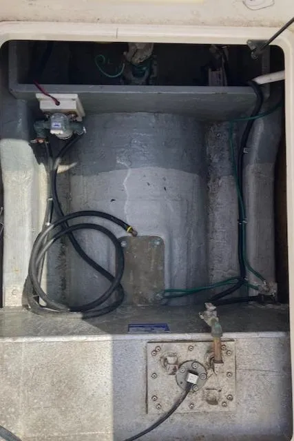 Slide: The Image of 2005 Back Cove Downeast Hardtop engine compartment with visible wiring and components. - 46