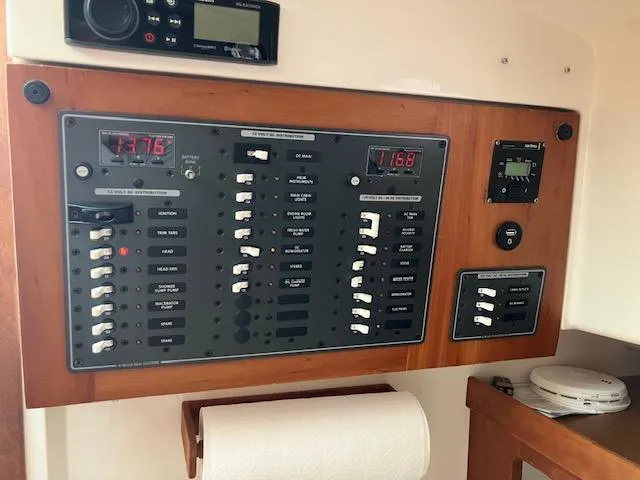 Slide: The Image of Electrical control panel on a 2005 Back Cove Downeast Hardtop boat interior. - 8