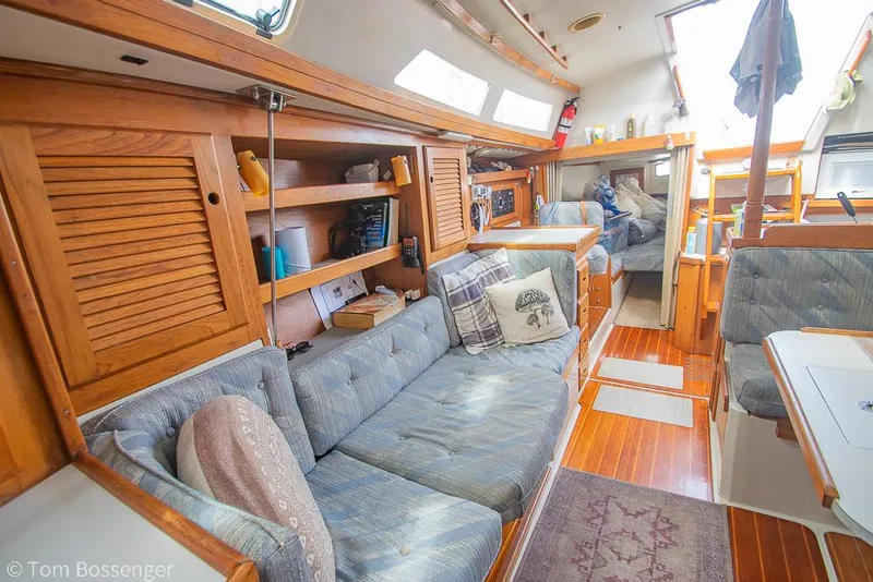 Slide: The Image of Interior of a 1992 Catalina 36 sailboat with cozy seating and wooden cabinetry. - 16