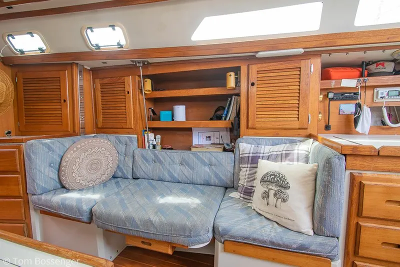 Slide: The Image of Cozy interior of 1992 Catalina 36 sailboat with cushioned seating and wooden cabinetry. - 17