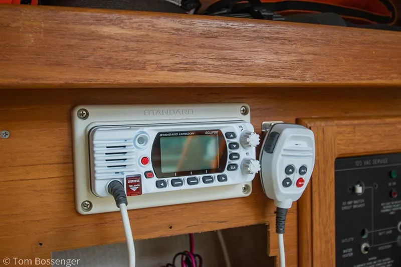 Slide: The Image of VHF radio system on 1992 Catalina 36 sailboat, featuring a microphone and control panel. - 24