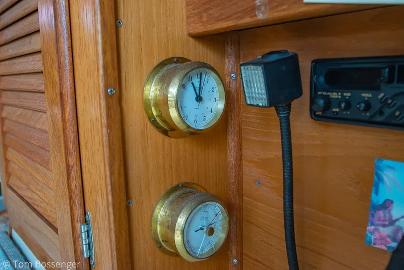 Slide: The Image of Interior of 1992 Catalina 36 yacht with brass clocks and radio equipment. - 25
