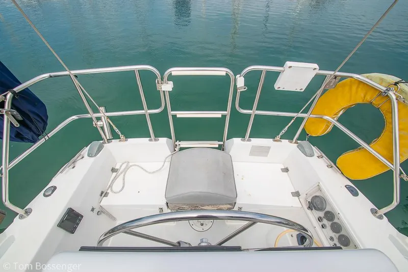 Slide: The Image of Cockpit view of 1992 Catalina 36 sailboat with steering wheel and safety equipment. - 27