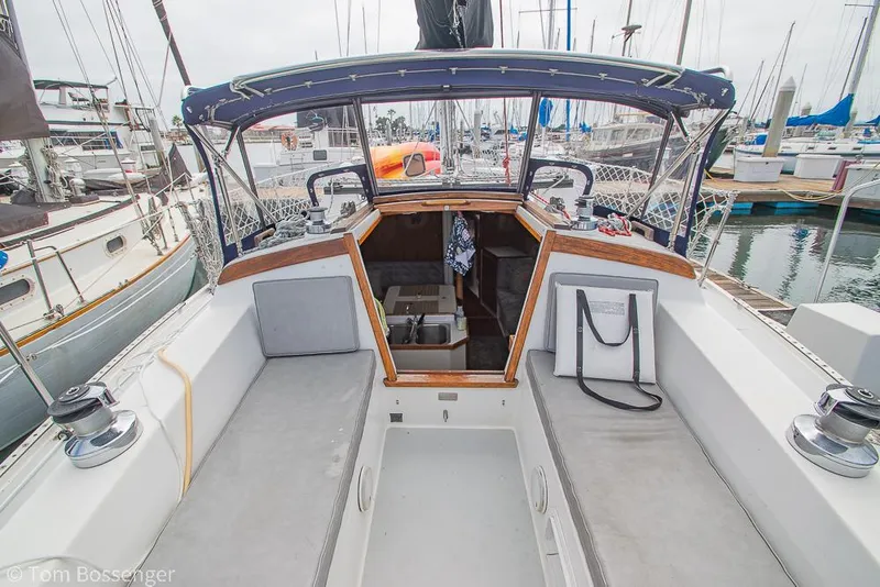 Slide: The Image of 1992 Catalina 36 sailboat cockpit with open cabin, docked at marina. - 29