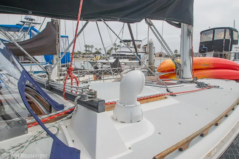 Slide: The Image of Sailboat deck view of 1992 Catalina 36 in marina, featuring rigging and equipment. - 37