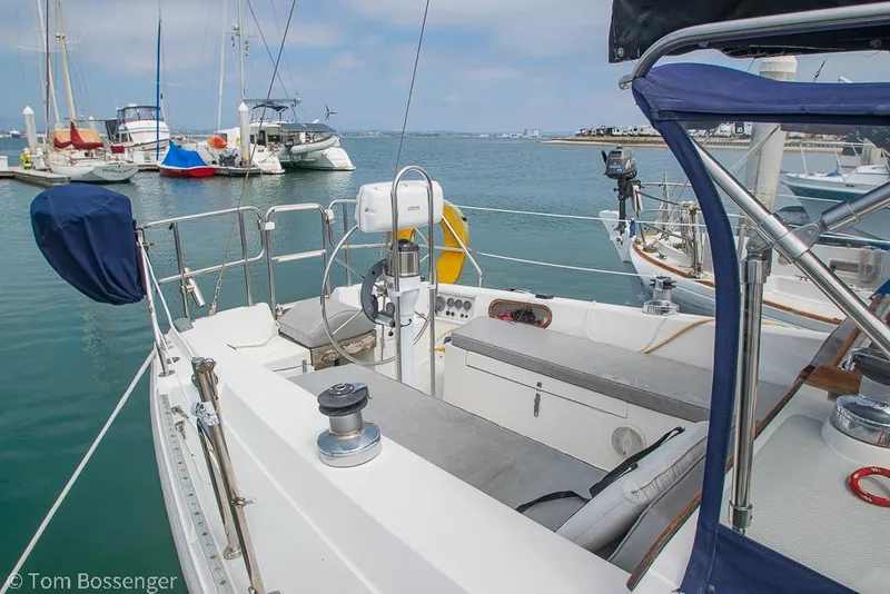 Slide: The Image of Sailboat Catalina 36, 1992 model, docked in a marina with clear skies. - 5