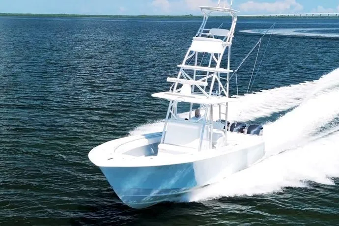 Slide: The Image of 2018 Contender 39 ST boat cruising on open water, showcasing sleek design and speed. - 3