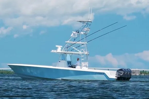 Slide: The Image of 2018 Contender 39 ST boat on water, clear sky, fishing rods visible. - 5