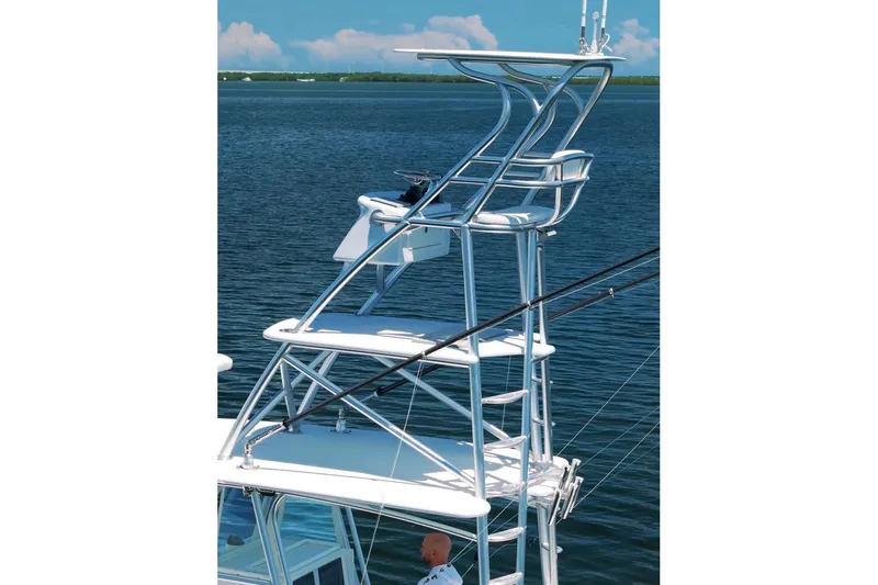 Slide: The Image of 2018 Contender 39 ST boat with a tall observation tower on calm water. - 6