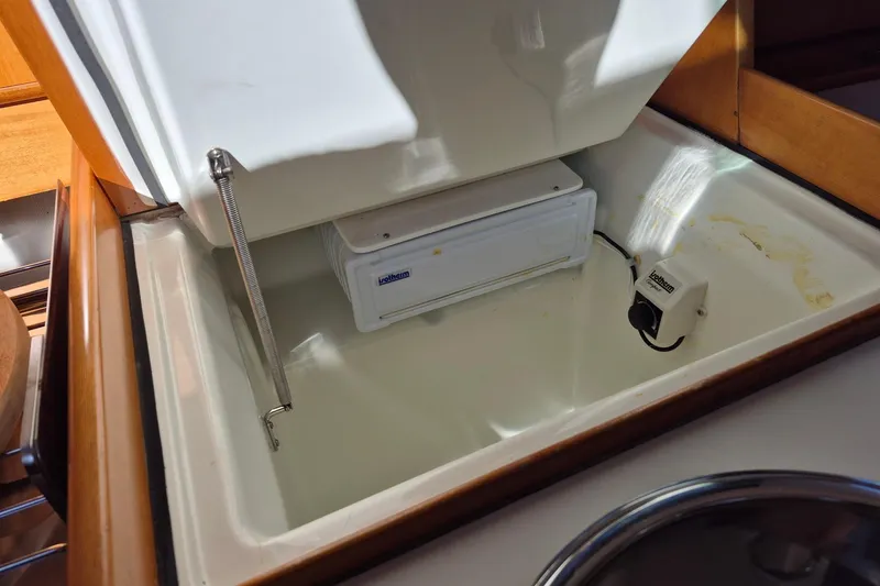 Slide: The Image of Beneteau First 36s7 1996 yacht interior fridge compartment with Lofrans control. - 17