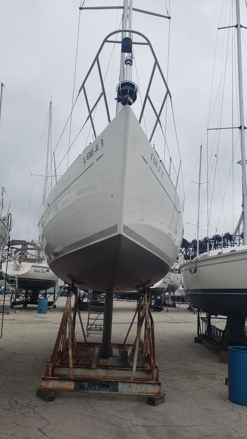 Slide: The Image of 1996 Beneteau First 36s7 sailboat on dry dock, viewed from the front. - 3