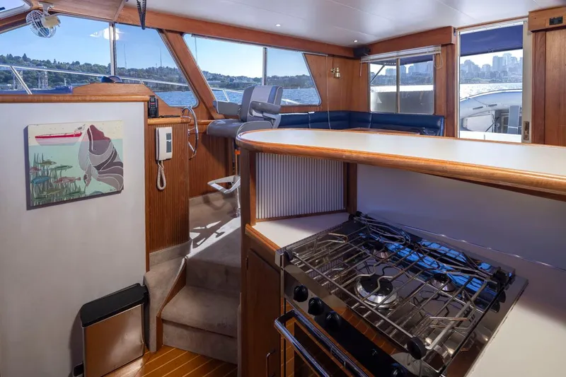 Slide: The Image of Interior of 1993 Tollycraft 40 Sport Sedan with kitchen and seating area. - 16