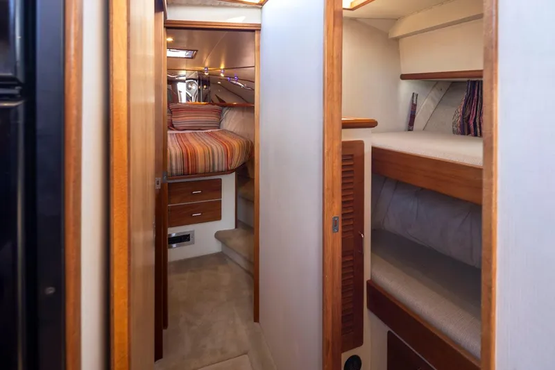 Slide: The Image of Interior of 1993 Tollycraft 40 Sport Sedan with cozy cabin and wooden accents. - 20