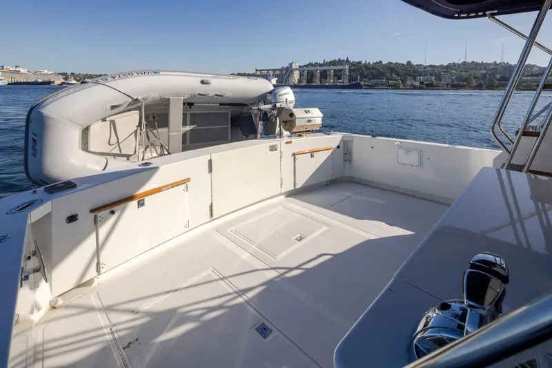 Slide: The Image of 1993 Tollycraft 40 Sport Sedan yacht deck with scenic waterfront view. - 34