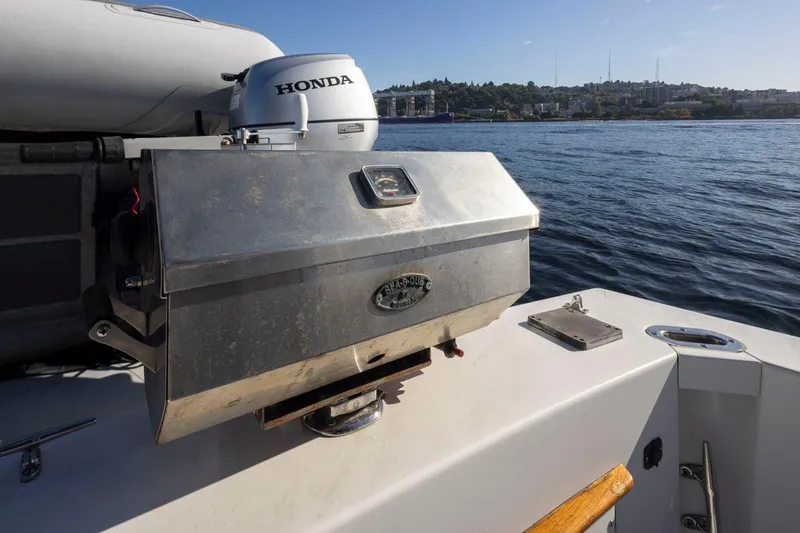 Slide: The Image of 1993 Tollycraft 40 Sport Sedan with a stainless steel grill on deck, near water. - 36