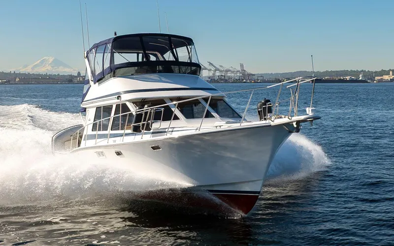 Slide: The Image of 1993 Tollycraft 40 Sport Sedan cruising on open water, showcasing sleek design and performance. - 9