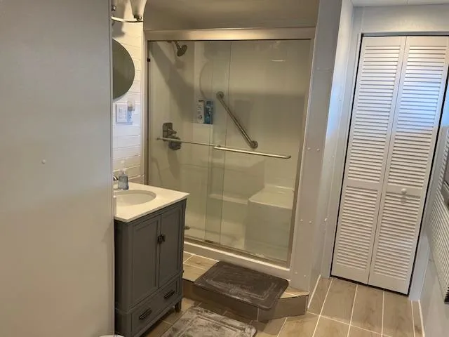 Slide: The Image of Modern bathroom in a 2001 Stardust Cruisers houseboat with glass shower and vanity. - 18