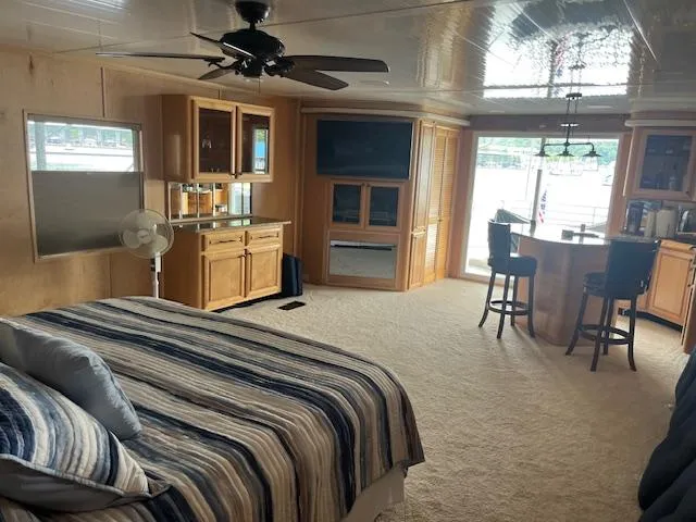 Slide: The Image of Luxurious 2001 Stardust Cruisers houseboat interior with cozy bedroom and modern amenities. - 22