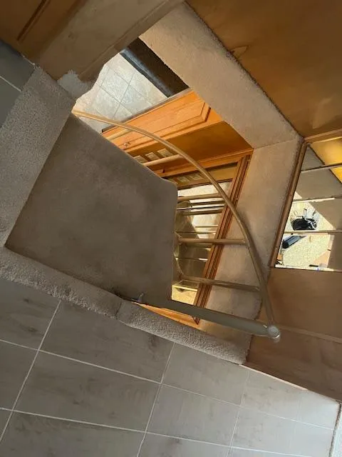 Slide: The Image of Staircase inside 2001 Stardust Cruisers 18 x 103 houseboat, featuring modern railing and tiled flooring. - 23