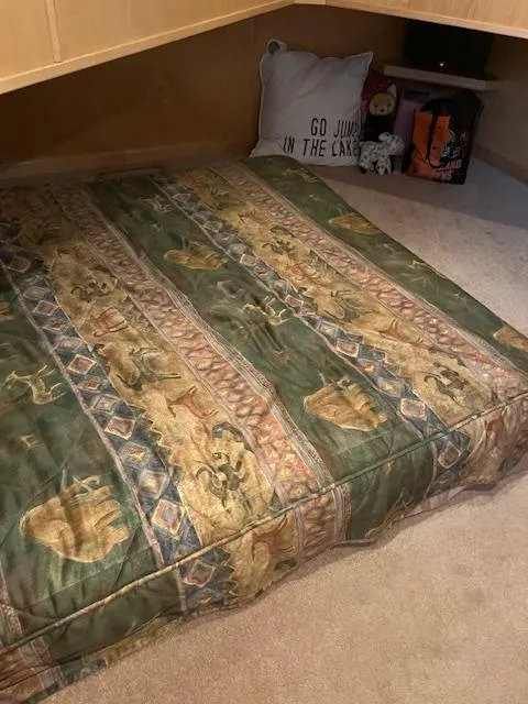 Slide: The Image of Cozy houseboat interior with patterned bedding and decorative pillow, Stardust Cruisers 18 x 103, 2001. - 32