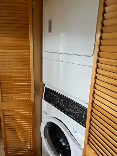 Slide: The Image of Stacked washer and dryer in 2001 Stardust Cruisers 18 x 103 houseboat laundry area. - 33