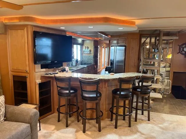 Slide: The Image of Luxurious 2001 Stardust Cruisers houseboat interior with bar, seating, and modern amenities. - 43