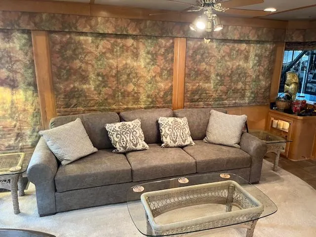 Slide: The Image of Luxurious 2001 Stardust Cruisers houseboat interior with elegant sofa and glass coffee table. - 45