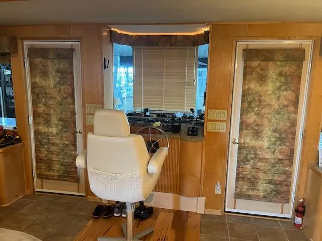 Slide: The Image of Interior of 2001 Stardust Cruisers houseboat with helm, chair, and doors. - 47