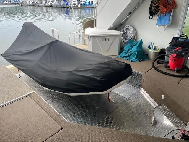 Slide: The Image of Covered jet ski on a 2001 Stardust Cruisers 18 x 103 houseboat deck. - 48