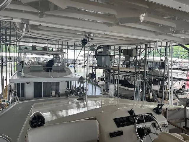 Slide: The Image of 2001 Stardust Cruisers 18 x 103 Houseboat docked in a marina. - 7