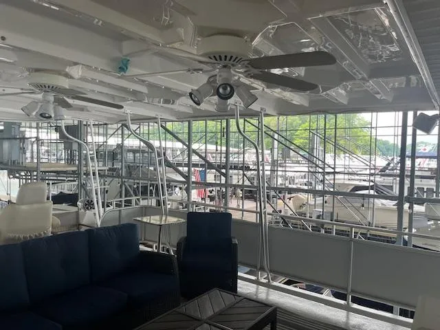 Slide: The Image of Interior of 2001 Stardust Cruisers 18 x 103 houseboat with seating and ceiling fans. - 8