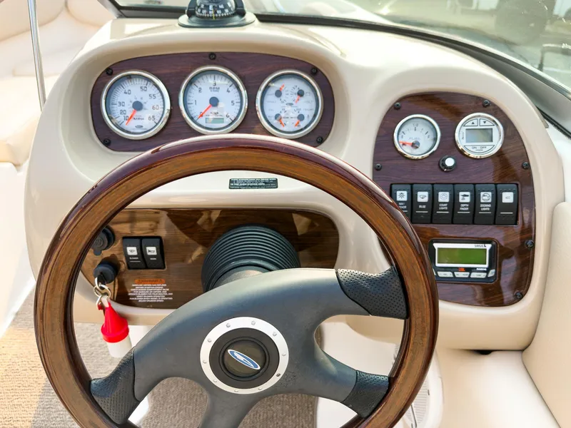 Slide: The Image of 2007 Chaparral 190 SSi boat dashboard with gauges and steering wheel. - 14