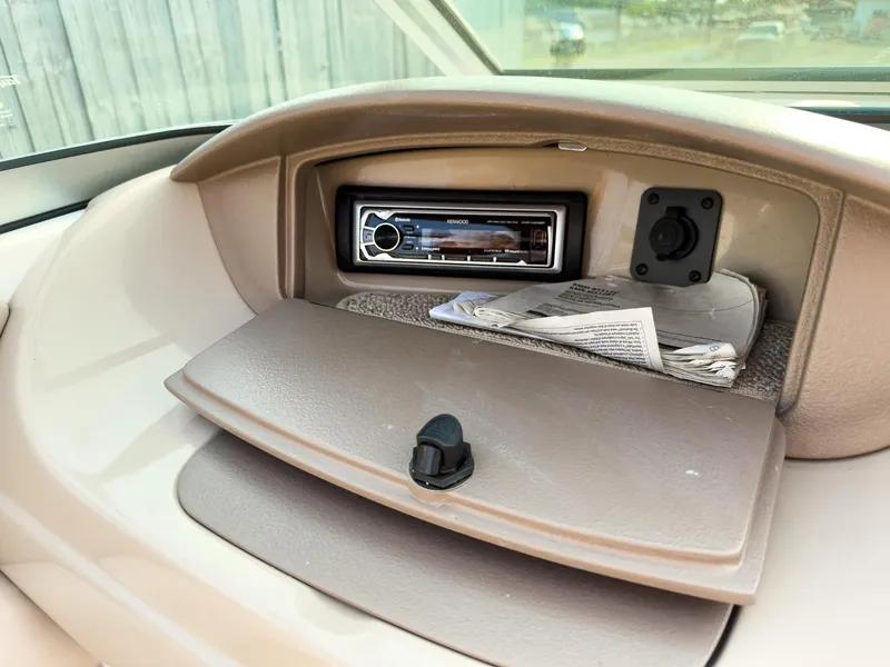 Slide: The Image of Dashboard of 2007 Chaparral 190 SSi boat with stereo system and storage compartment. - 19