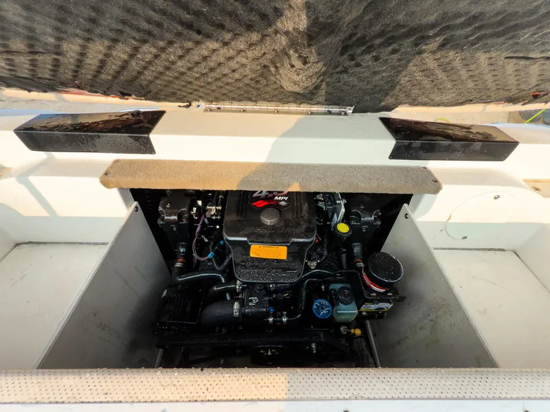 Slide: The Image of Engine compartment of a 2007 Chaparral 190 SSi boat, showcasing the motor details. - 29